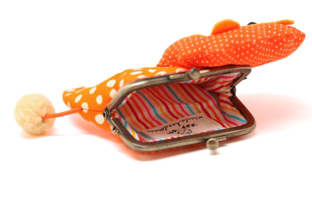 Little orange lion clutch purse in bubbly dotty print