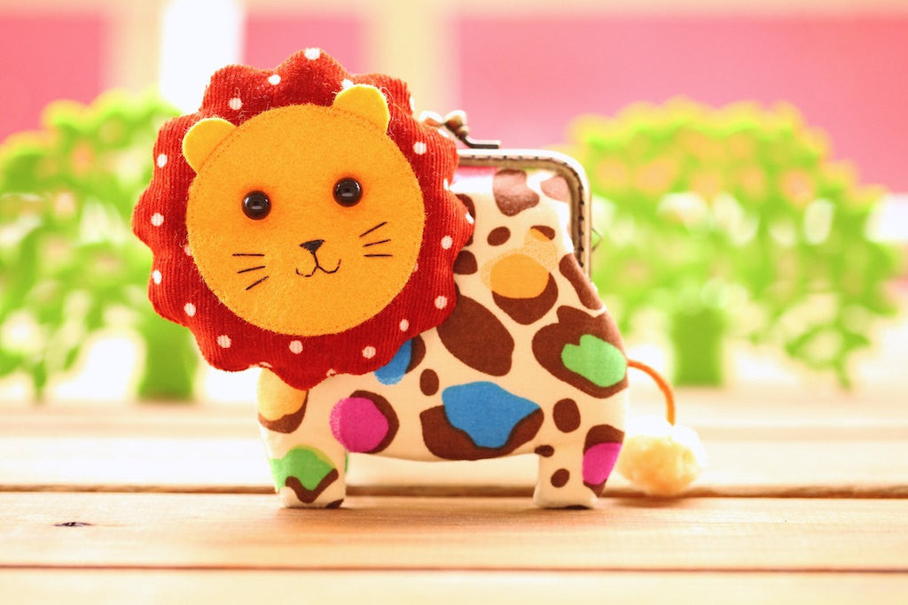 Little brown lion clutch purse in colorful leopard print